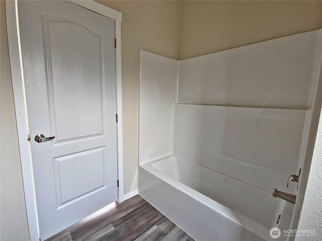 1303 30th Unit 3, Seaview, WA 98644 - bathroom with wood finished floors and bathtub / shower combination