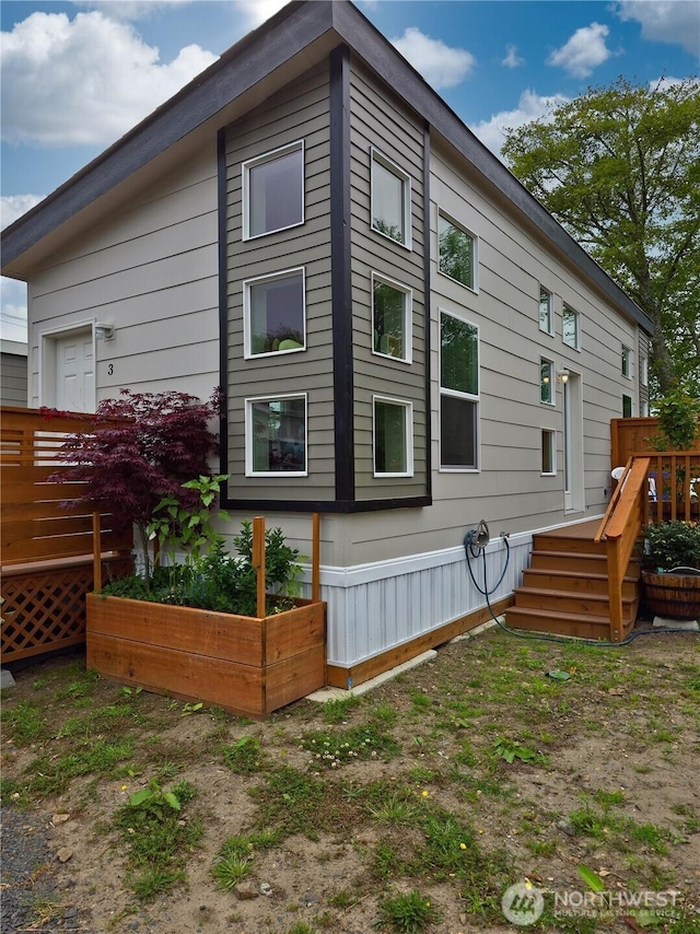1303 30th Unit 2, Seaview, WA 98644 - view of home's exterior with a deck