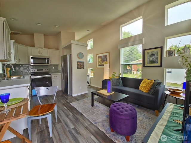 1303 30th Unit 2, Seaview, WA 98644 - living area with a towering ceiling, dark wood finished floors, and recessed lighting