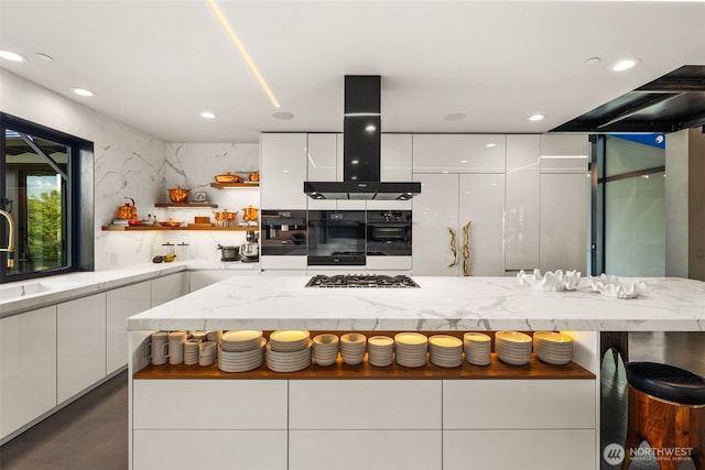 4014 E Mercer Way, Mercer Island, WA 98040 - kitchen featuring island range hood, modern cabinets, open shelves, stainless steel gas cooktop, and recessed lighting