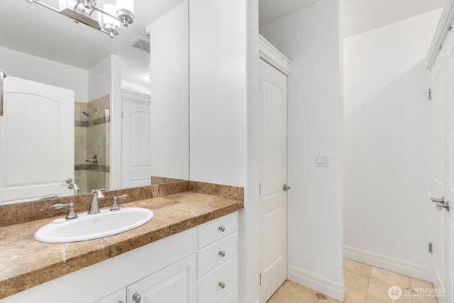 2551 Thorndyke Ave W Unit 302, Seattle, WA 98199 - bathroom with a tile shower, vanity, and tile patterned flooring