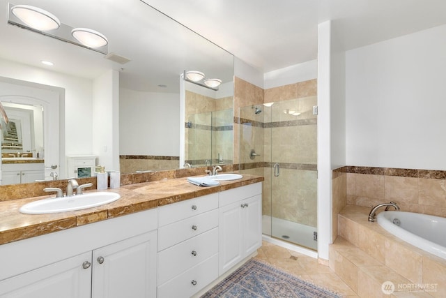 2551 Thorndyke Ave W Unit 302, Seattle, WA 98199 - full bath with a stall shower, a bath, double vanity, and tile patterned floors
