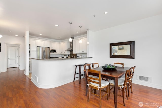 2551 Thorndyke Ave W Unit 302, Seattle, WA 98199 - dining space featuring dark wood-style flooring and recessed lighting