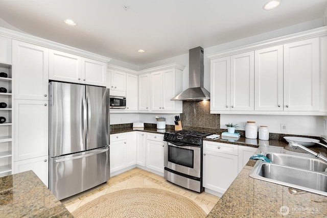 2551 Thorndyke Ave W Unit 302, Seattle, WA 98199 - kitchen featuring stainless steel appliances, wall chimney range hood, white cabinets, recessed lighting, and decorative backsplash