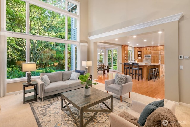 13695 NE 32nd Pl, Bellevue, WA 98005 - living room with a high ceiling, recessed lighting, and a chandelier