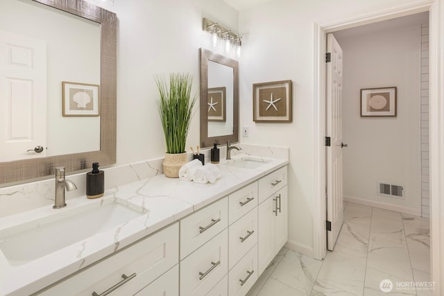 13695 NE 32nd Pl, Bellevue, WA 98005 - bathroom with marble look tiles and double vanity