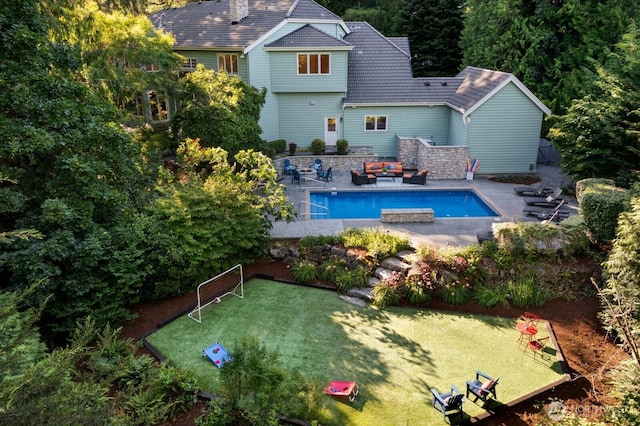 13695 NE 32nd Pl, Bellevue, WA 98005 - back of property featuring a lawn, an outdoor pool, and a patio