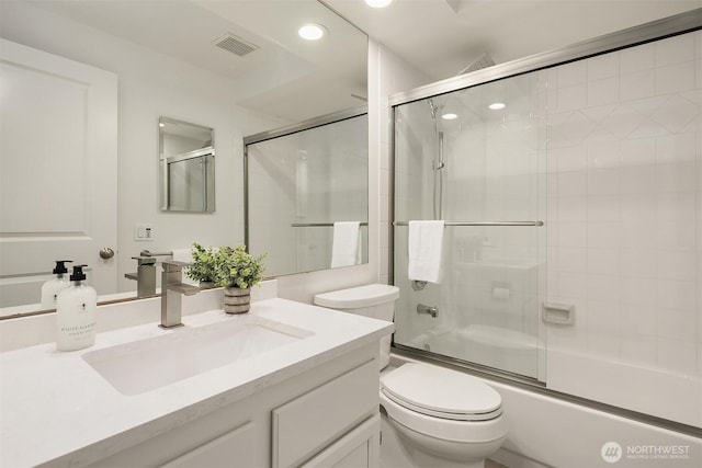 8527 134th Ct NE, Redmond, WA 98052 - bathroom with vanity, shower / bath combination with glass door, and recessed lighting
