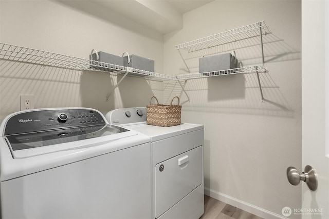 8527 134th Ct NE, Redmond, WA 98052 - laundry area with washing machine and dryer and light wood-style floors
