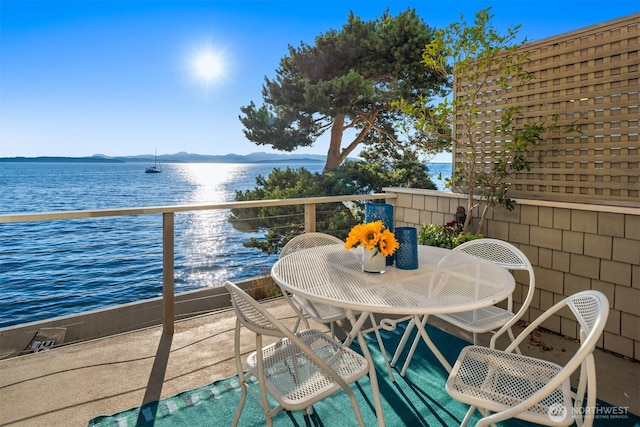 7117 Beach Dr SW, Seattle, WA 98136 - balcony with a water and mountain view and outdoor dining area