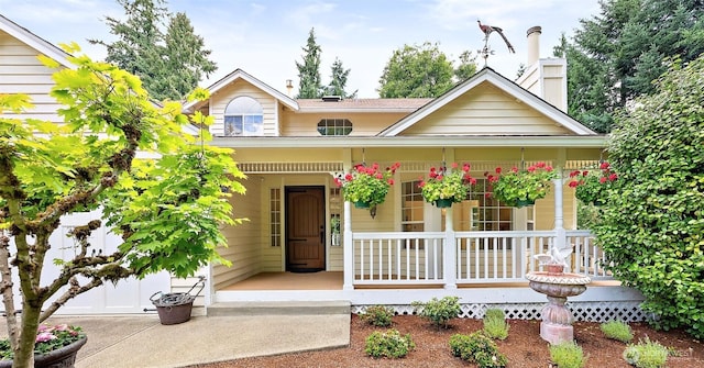 14013 116th Ave E, Puyallup, WA 98374 - view of front of house featuring a porch and a chimney
