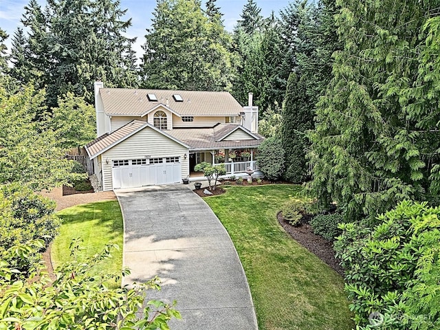 14013 116th Ave E, Puyallup, WA 98374 - view of front of property featuring a chimney, a front yard, concrete driveway, covered porch, and a garage