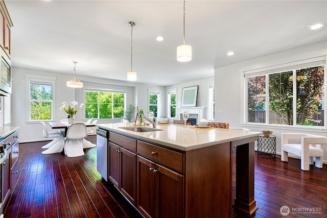 4529 185th Pl SE, Bothell, WA 98012 - kitchen with light countertops, dark wood finished floors, pendant lighting, recessed lighting, and an island with sink