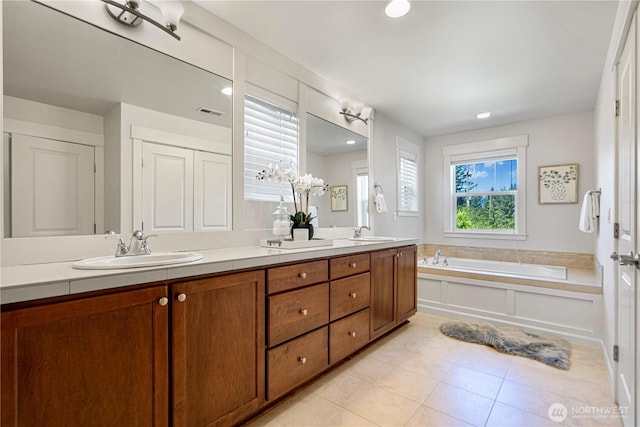 4529 185th Pl SE, Bothell, WA 98012 - full bathroom with double vanity, a garden tub, recessed lighting, and tile patterned floors