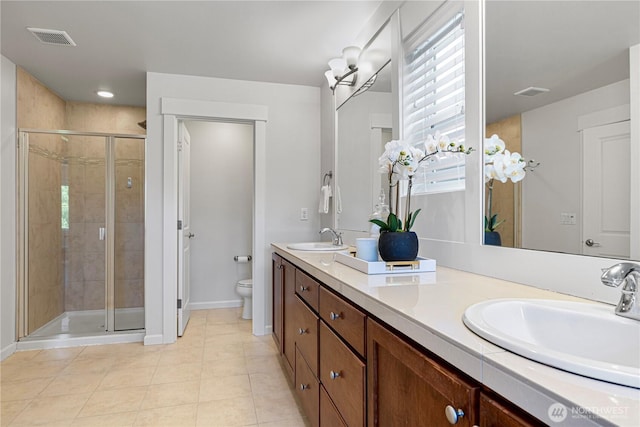 4529 185th Pl SE, Bothell, WA 98012 - full bathroom with double vanity, a stall shower, and tile patterned floors