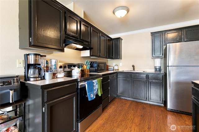 438 Washington Blvd Unit 3, Algona, WA 98001 - kitchen with appliances with stainless steel finishes, under cabinet range hood, dark wood finished floors, and ornamental molding