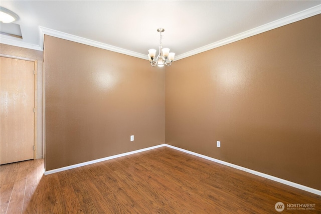 438 Washington Blvd Unit 3, Algona, WA 98001 - spare room with ornamental molding, a chandelier, and wood finished floors