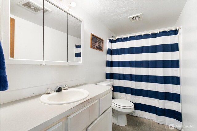 438 Washington Blvd Unit 3, Algona, WA 98001 - full bath featuring vanity, tile patterned floors, a textured ceiling, and a shower with shower curtain