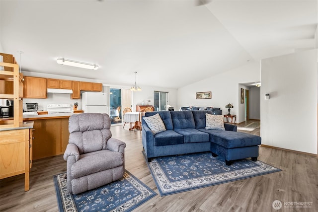 1346 Chatham Dr SE, Olympia, WA 98513 - living room with light wood-style floors, a chandelier, and lofted ceiling