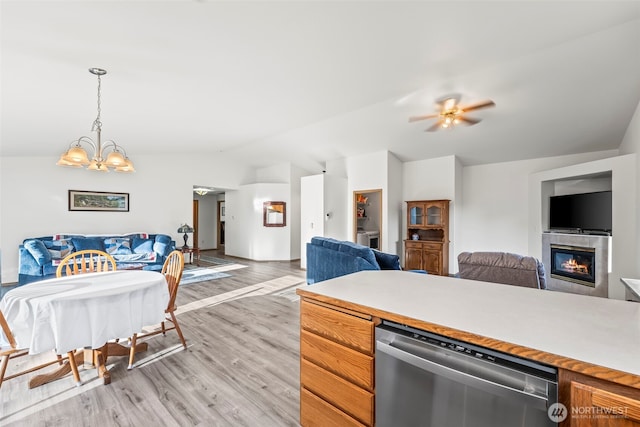 1346 Chatham Dr SE, Olympia, WA 98513 - kitchen with dishwasher, open floor plan, light wood finished floors, vaulted ceiling, and light countertops