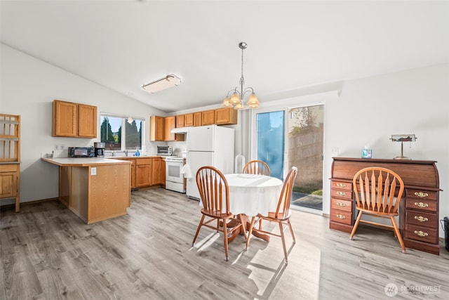 1346 Chatham Dr SE, Olympia, WA 98513 - kitchen with white appliances, light wood-style floors, a peninsula, lofted ceiling, and a chandelier