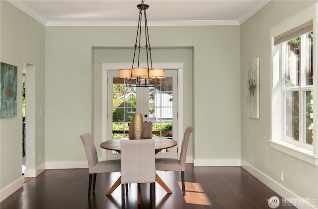 6208 Fremont Ave N, Seattle, WA 98103 - dining room featuring dark wood-style floors, crown molding, and a chandelier