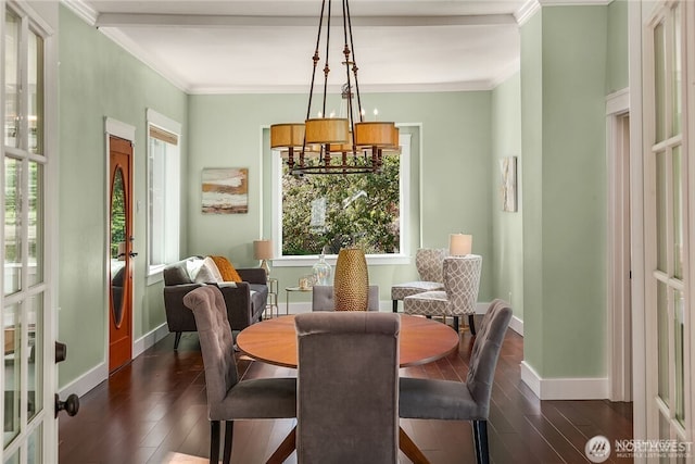 6208 Fremont Ave N, Seattle, WA 98103 - dining area featuring healthy amount of natural light, french doors, dark wood-type flooring, ornamental molding, and a chandelier