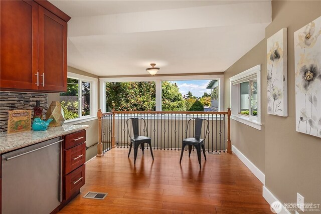 6208 Fremont Ave N, Seattle, WA 98103 - kitchen featuring dishwasher, healthy amount of natural light, and wood finished floors