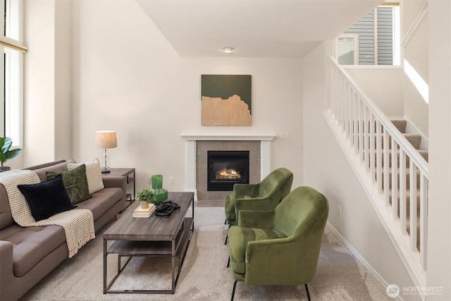 17515 110th Ln SE Unit 27, Renton, WA 98055 - carpeted living room featuring a tile fireplace and baseboards
