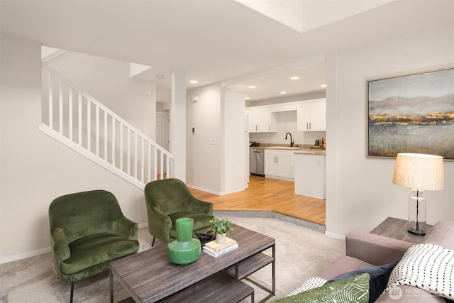 17515 110th Ln SE Unit 27, Renton, WA 98055 - living area with light carpet, stairs, and recessed lighting