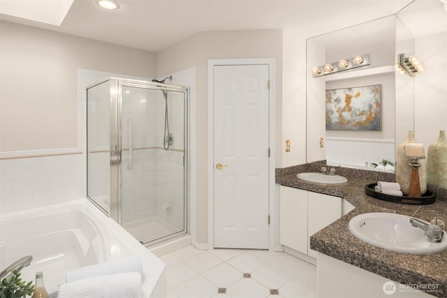 17515 110th Ln SE Unit 27, Renton, WA 98055 - full bath featuring a stall shower, a bath, double vanity, tile patterned floors, and recessed lighting