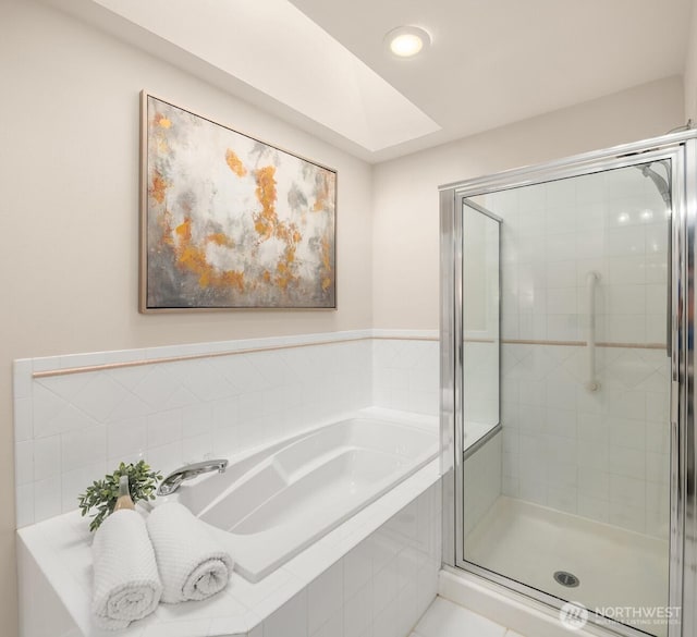17515 110th Ln SE Unit 27, Renton, WA 98055 - bathroom featuring a bath, a shower stall, and recessed lighting