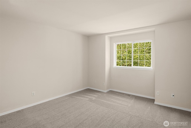 17515 110th Ln SE Unit 27, Renton, WA 98055 - spare room featuring carpet floors and baseboards