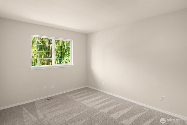 17515 110th Ln SE Unit 27, Renton, WA 98055 - empty room featuring baseboards and carpet flooring