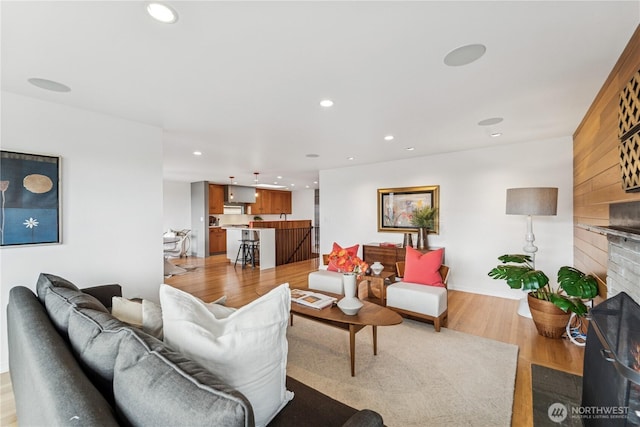 2626 W Lynn St, Seattle, WA 98199 - living area with a fireplace, light wood-style flooring, and recessed lighting