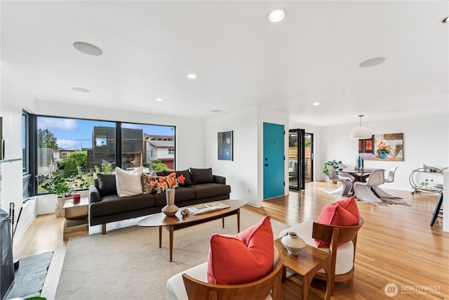 2626 W Lynn St, Seattle, WA 98199 - living area featuring wood finished floors and recessed lighting