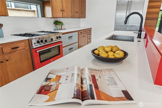2626 W Lynn St, Seattle, WA 98199 - kitchen featuring stainless steel range, light countertops, and brown cabinetry