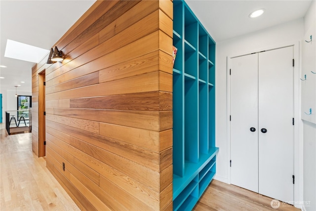 2626 W Lynn St, Seattle, WA 98199 - hallway featuring light wood-style floors, wood walls, recessed lighting, and a skylight