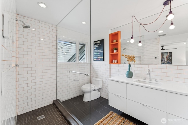 2626 W Lynn St, Seattle, WA 98199 - full bathroom with tile walls, vanity, tiled shower, tile patterned flooring, and recessed lighting