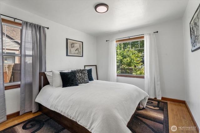 7012 S Warner St, Tacoma, WA 98409 - bedroom featuring wood finished floors and baseboards