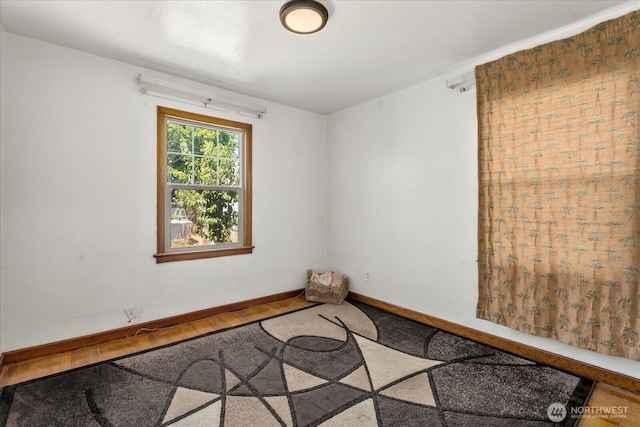 7012 S Warner St, Tacoma, WA 98409 - empty room featuring baseboards and wood finished floors
