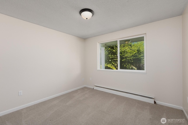 10414 43rd Street Ct E, Edgewood, WA 98372 - unfurnished room featuring baseboard heating, carpet flooring, and a textured ceiling