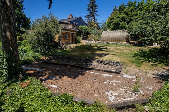 10414 43rd Street Ct E, Edgewood, WA 98372 - view of yard featuring an outdoor structure and a balcony