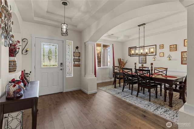 22817 80th Avenue Ct E, Graham, WA 98338 - foyer entrance with a raised ceiling, arched walkways, hardwood / wood-style floors, decorative columns, and a chandelier