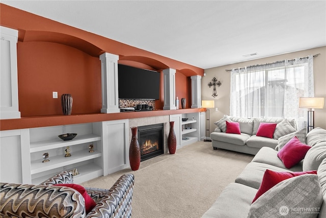 22817 80th Avenue Ct E, Graham, WA 98338 - carpeted living room with decorative columns and a tile fireplace