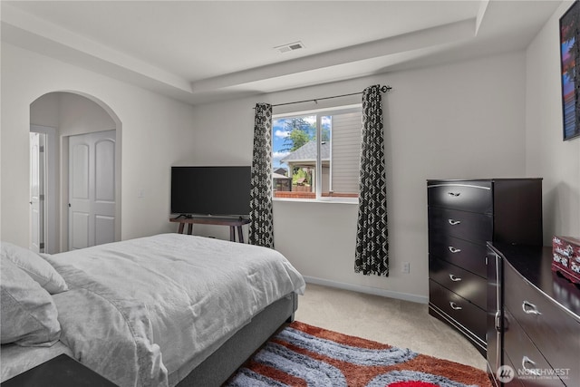 22817 80th Avenue Ct E, Graham, WA 98338 - bedroom with light carpet, arched walkways, and a raised ceiling