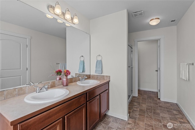 22817 80th Avenue Ct E, Graham, WA 98338 - bathroom with double vanity, a stall shower, and stone finish floors