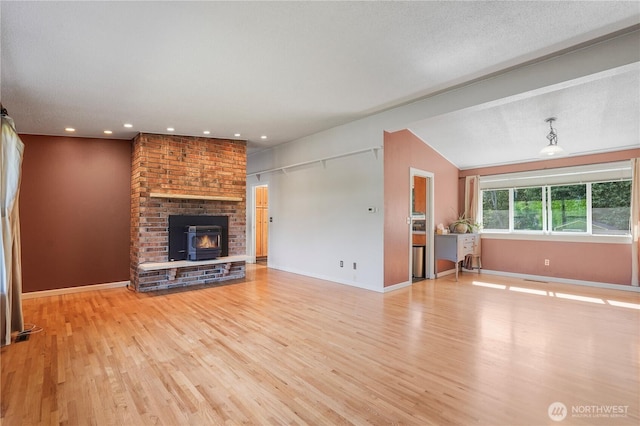 2120 Seaview St W, University Place, WA 98466 - unfurnished living room with light wood-style floors, lofted ceiling, recessed lighting, and a brick fireplace