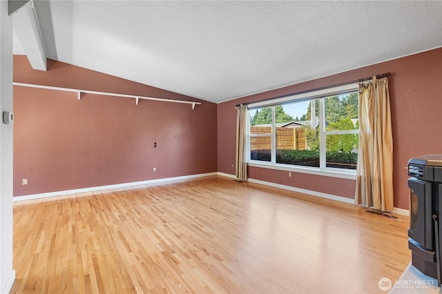 2120 Seaview St W, University Place, WA 98466 - unfurnished living room featuring light wood-style flooring and a wood stove