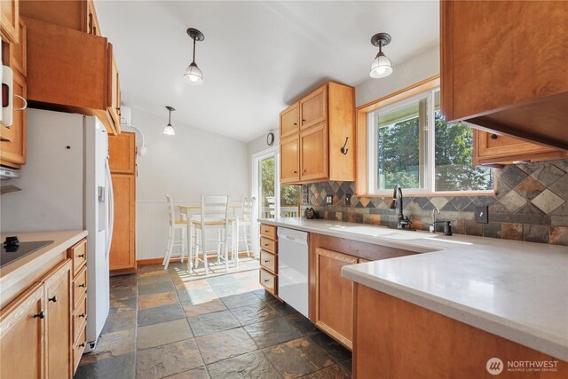 2120 Seaview St W, University Place, WA 98466 - kitchen featuring white appliances, stone tile flooring, backsplash, healthy amount of natural light, and vaulted ceiling